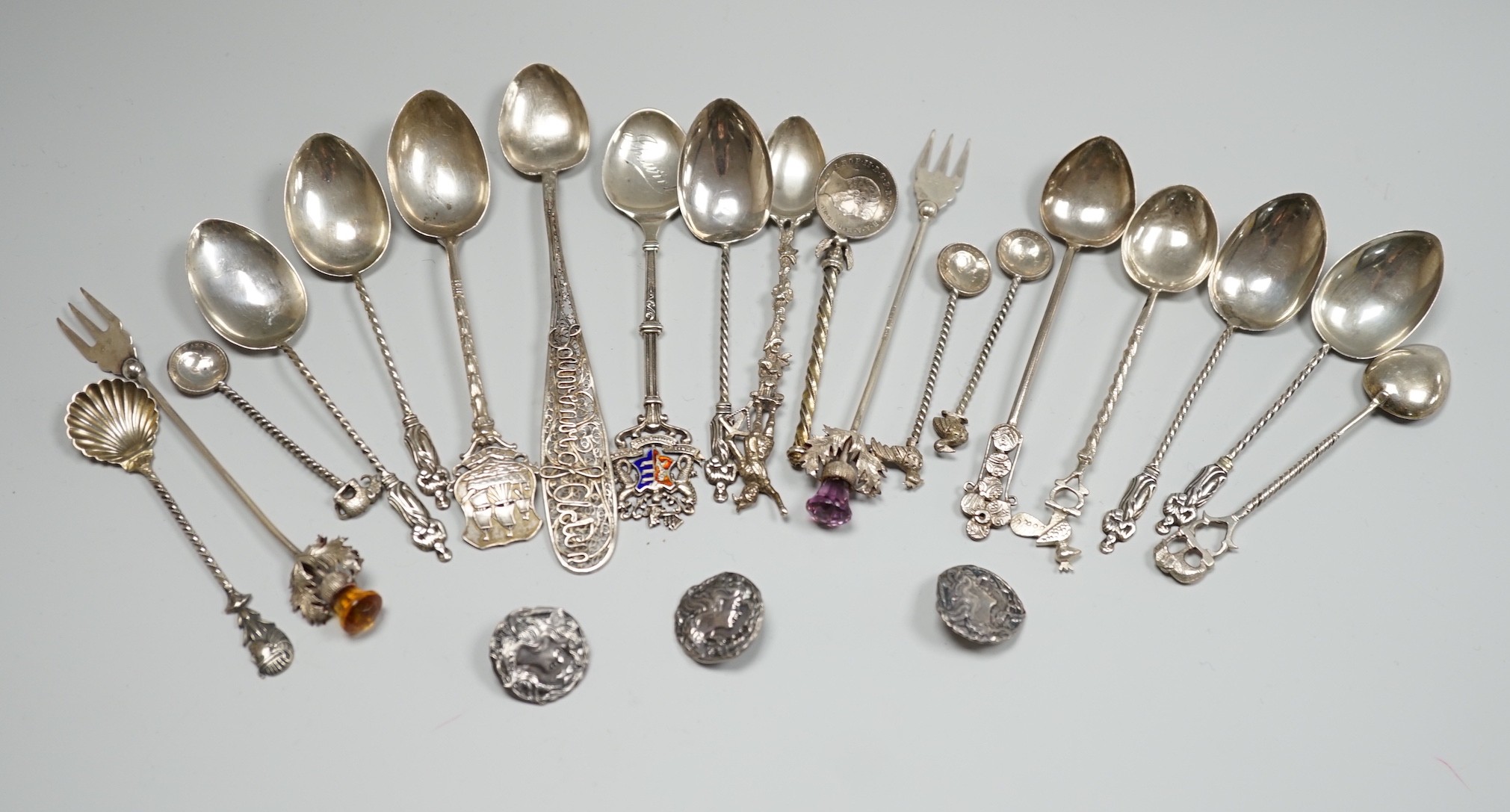 A collection of small silver and white metal spoons and forks including commemorative and three Art Nouveau silver buttons, Birmingham, 1901.